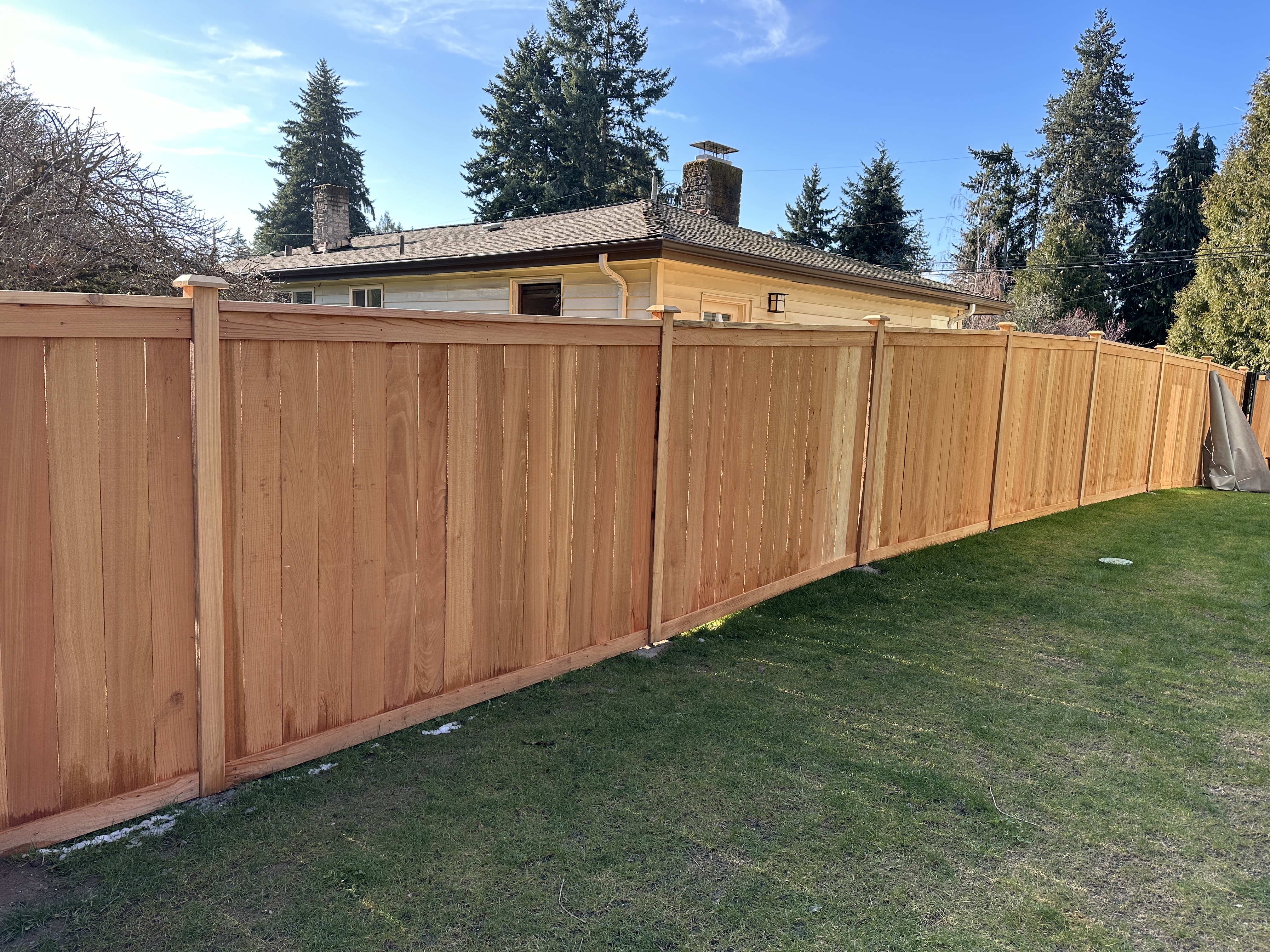 knocking wood fence caps in Seattle